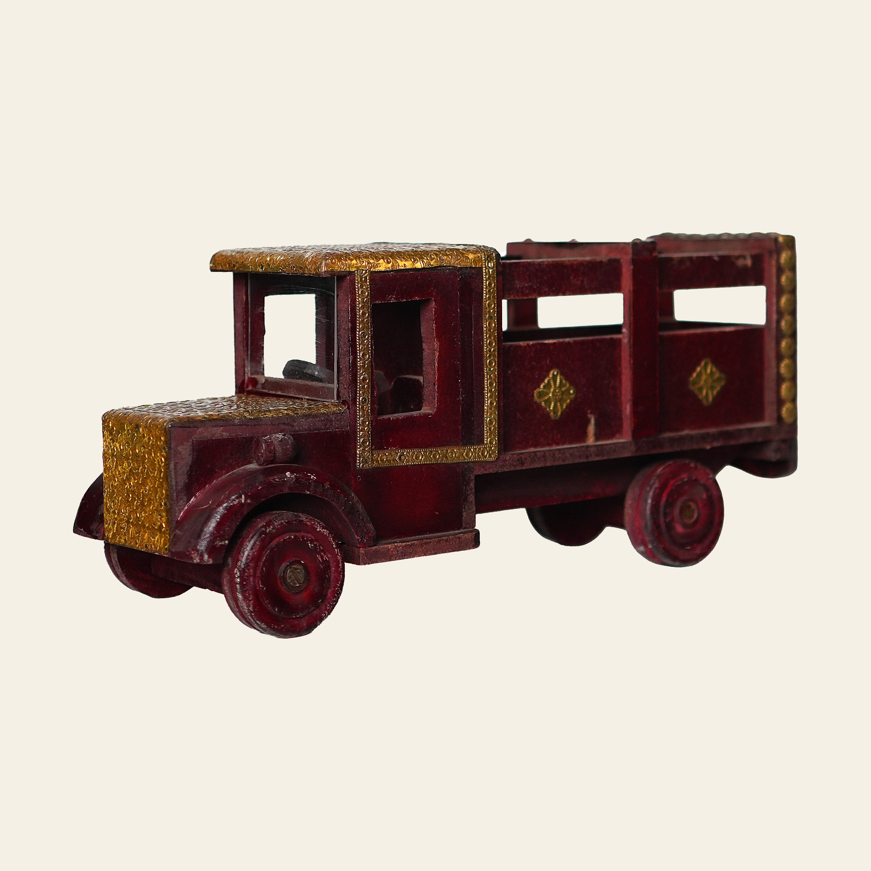 Vintage-style toy truck with a red and gold color scheme